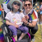 FACSFLA staff member with child at Napanee Pride March