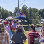 New progress Pride Flag and people walking in Napanee Pride March