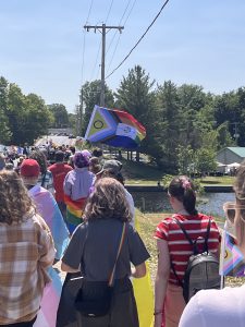 New progress Pride Flag and people walking in Napanee Pride March